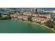 Scenic waterfront homes with balconies and lush lawns along a tranquil canal at 459 Haven Point Dr, Treasure Island, FL 33706