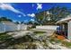 Fenced backyard featuring a brick paver pad, mulch planters, and a bench for comfortable outdoor living at 4616 5Th N Ave, St Petersburg, FL 33713