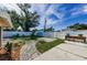Well-maintained backyard with paver path, green grass, privacy fence, and space for gardening at 4616 5Th N Ave, St Petersburg, FL 33713