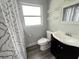 Bathroom featuring a vanity, toilet, and shower with decorative curtain, plus useful storage at 4616 5Th N Ave, St Petersburg, FL 33713