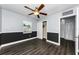 This bedroom has wood floors, a ceiling fan, and a closet with ample space at 4616 5Th N Ave, St Petersburg, FL 33713