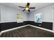 Well-lit bedroom with wood floors, neutral walls, and a classic ceiling fan at 4616 5Th N Ave, St Petersburg, FL 33713