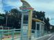 Modern bus stop with the signage 'Beach SunRunner to Burg', located on 48th street at 4616 5Th N Ave, St Petersburg, FL 33713