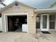 Garage exterior featuring the house number and a garage with storage at 4616 5Th N Ave, St Petersburg, FL 33713