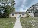 Charming home exterior with a well-manicured lawn, sidewalk, and a cozy inviting ambiance at 4616 5Th N Ave, St Petersburg, FL 33713