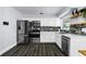 Modern kitchen with stainless steel appliances, stylish backsplash, bright lighting and an open layout at 4616 5Th N Ave, St Petersburg, FL 33713