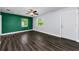 Inviting living room featuring hardwood floors, ceiling fan, and access to outdoor areas at 4616 5Th N Ave, St Petersburg, FL 33713