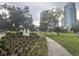 Lush city park with walking paths, landscaping, and views of high-rise buildings in the background at 4616 5Th N Ave, St Petersburg, FL 33713