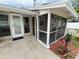 Enclosed porch overlooking the backyard with a door leading into the house at 4616 5Th N Ave, St Petersburg, FL 33713