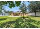 Spacious backyard with a patio and lush green lawn, perfect for entertaining and relaxation at 4816 N Fremont Ave, Tampa, FL 33603