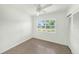 A well-lit bedroom features a closet and a window providing natural light at 4816 N Fremont Ave, Tampa, FL 33603