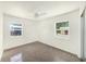 Bright bedroom with two windows and a ceiling fan for comfort at 4816 N Fremont Ave, Tampa, FL 33603