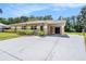 Well-maintained single-story home with a carport and a spacious paved driveway at 4816 N Fremont Ave, Tampa, FL 33603