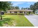 Charming single-story home with a well-manicured lawn and a convenient carport at 4816 N Fremont Ave, Tampa, FL 33603