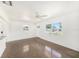 Inviting living room featuring terrazzo flooring and large windows for ample natural light at 4816 N Fremont Ave, Tampa, FL 33603