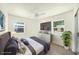 Beautiful staged main bedroom with ample sunlight and updated finishes at 4816 N Fremont Ave, Tampa, FL 33603