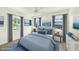 Comfortable main bedroom with large windows, soft lighting, and calming decor at 4816 N Fremont Ave, Tampa, FL 33603