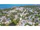 Overhead view of the property in a neighborhood setting with nearby amenities and water views at 551 Bay St, Dunedin, FL 34698