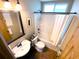 Well-maintained bathroom featuring a shower-tub combo and modern fixtures at 5812 Montana Ave, New Port Richey, FL 34652