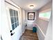 Inviting entrance with natural light, stylish decor, and wood-look flooring at 5812 Montana Ave, New Port Richey, FL 34652