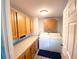 Convenient laundry room with storage cabinets and modern appliances at 5812 Montana Ave, New Port Richey, FL 34652