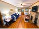 Cozy living room with hardwood floors, stone fireplace, and comfortable seating at 5812 Montana Ave, New Port Richey, FL 34652