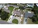 Aerial view of a property featuring well-maintained landscaping, circular driveway, and fenced backyard with a pool nearby at 6045 2Nd N Ave, St Petersburg, FL 33710