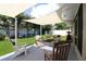 Relaxing backyard patio area with shade sails, comfortable seating, and lush landscaping at 6045 2Nd N Ave, St Petersburg, FL 33710