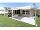 Outdoor patio featuring a shaded area, comfortable seating, and a well-manicured lawn at 6045 2Nd N Ave, St Petersburg, FL 33710