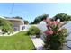 Well-maintained backyard featuring a privacy fence, lush lawn, and mature landscaping at 6045 2Nd N Ave, St Petersburg, FL 33710
