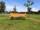 A sign for Bear Creek Park surrounded by green grass and trees, indicating a recreational space for the community at 6045 2Nd N Ave, St Petersburg, FL 33710