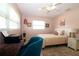 Cozy bedroom with pink walls, a single bed, a desk, and two windows at 6045 2Nd N Ave, St Petersburg, FL 33710