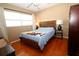 Well-lit bedroom featuring light wood floors, neutral walls, and a large window at 6045 2Nd N Ave, St Petersburg, FL 33710