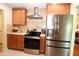 Kitchen with light wood cabinets, stainless appliances, and a brick-style backsplash at 6045 2Nd N Ave, St Petersburg, FL 33710