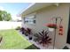 Landscaped yard featuring a flower bed, decorative lighting, and well-maintained lawn at 6045 2Nd N Ave, St Petersburg, FL 33710