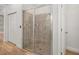Tiled shower with glass door in a bathroom with light-colored floors at 6519 Watson Rd, Riverview, FL 33578