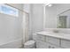Well-lit bathroom with a shower-tub combination and a single sink vanity at 6519 Watson Rd, Riverview, FL 33578