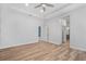 Bright bedroom with recessed lighting, neutral walls, and light-colored wood-look flooring at 6519 Watson Rd, Riverview, FL 33578