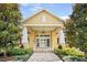 Entrance to the community clubhouse with manicured landscaping and welcoming entrance at 6519 Watson Rd, Riverview, FL 33578