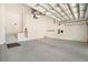 Spacious two-car garage with a sealed concrete floor, steps to the home, and an electric car charger at 6519 Watson Rd, Riverview, FL 33578