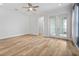 Bright and airy living room with access to a patio and light-colored floors at 6519 Watson Rd, Riverview, FL 33578