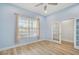 Comfortable space with great natural light, ceiling fan, and a view to the adjacent room at 6519 Watson Rd, Riverview, FL 33578