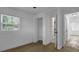 Bedroom with window offering natural light and doorway to hall or closet at 708 E Annie St, Tampa, FL 33612