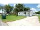 View of a freshly painted single-story home with a well-lit and tidy exterior at 708 E Annie St, Tampa, FL 33612
