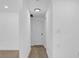 Bright hallway with light-colored wood-look floors and neutral white paint at 708 E Annie St, Tampa, FL 33612
