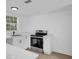 Modern kitchen featuring stainless steel appliances and quartz countertops at 708 E Annie St, Tampa, FL 33612