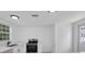 Well-lit kitchen featuring modern appliances and ample counter space at 708 E Annie St, Tampa, FL 33612