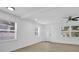 Bright living room with modern finishes, featuring hardwood floors and large windows at 708 E Annie St, Tampa, FL 33612