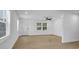 Bright and airy living room featuring hardwood floors and ample natural light at 708 E Annie St, Tampa, FL 33612