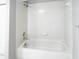 Clean, bright, tiled bathtub in a neutral-toned bathroom at 7148 E Bank Dr # 7148, Tampa, FL 33617